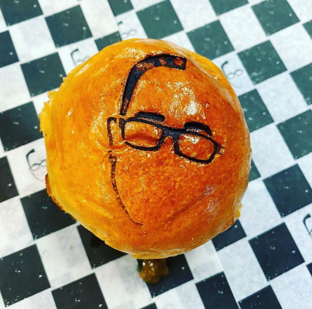 Sam the Cooking Guy logo burned into a bun